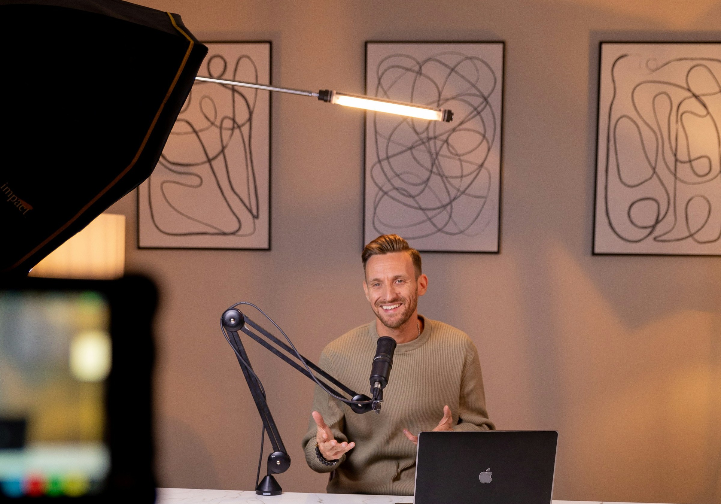 A person sitting in front of a window with soft, natural light, demonstrating good lighting.